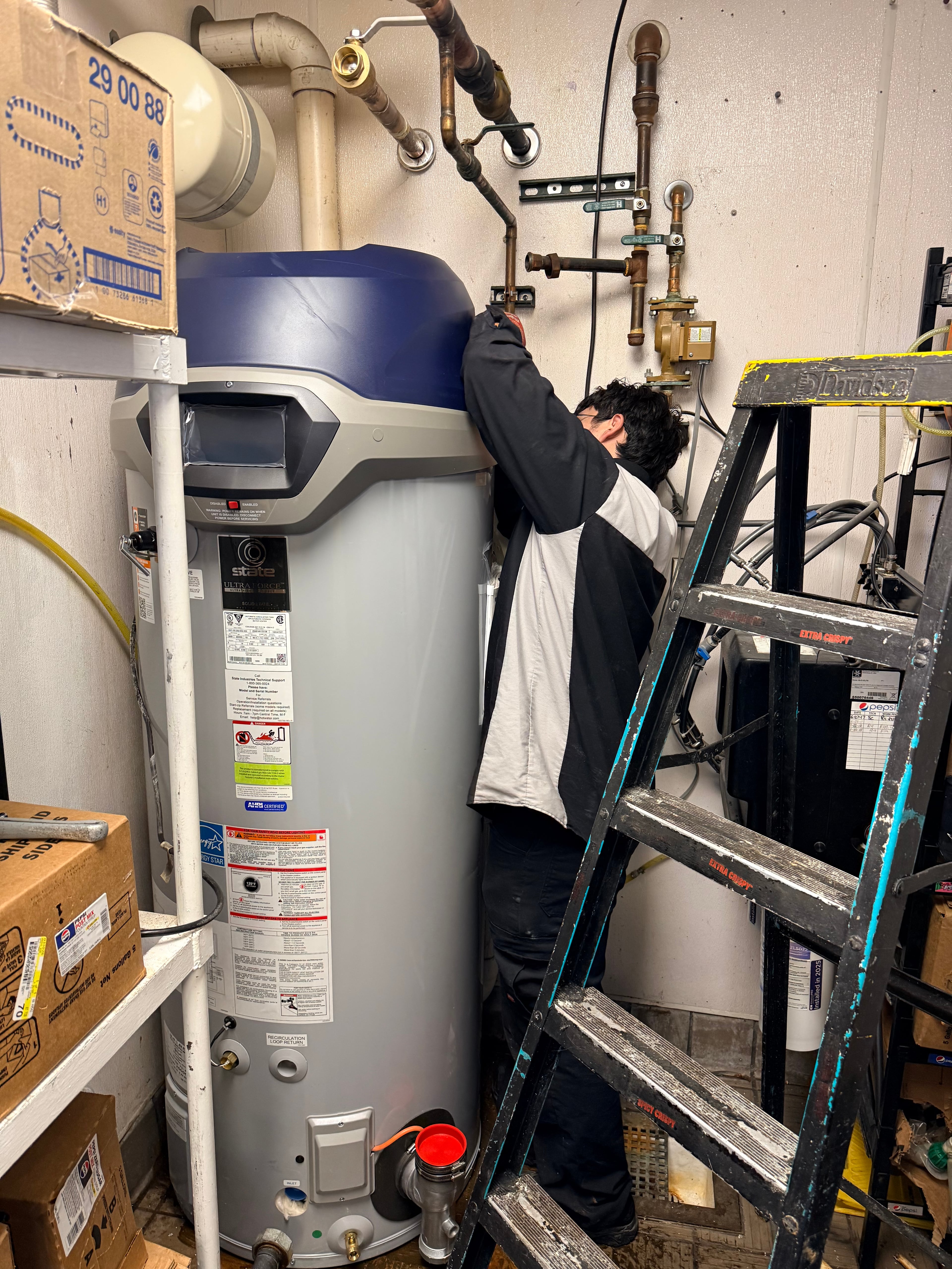 Eagle Repair technician servicing commercial boiler